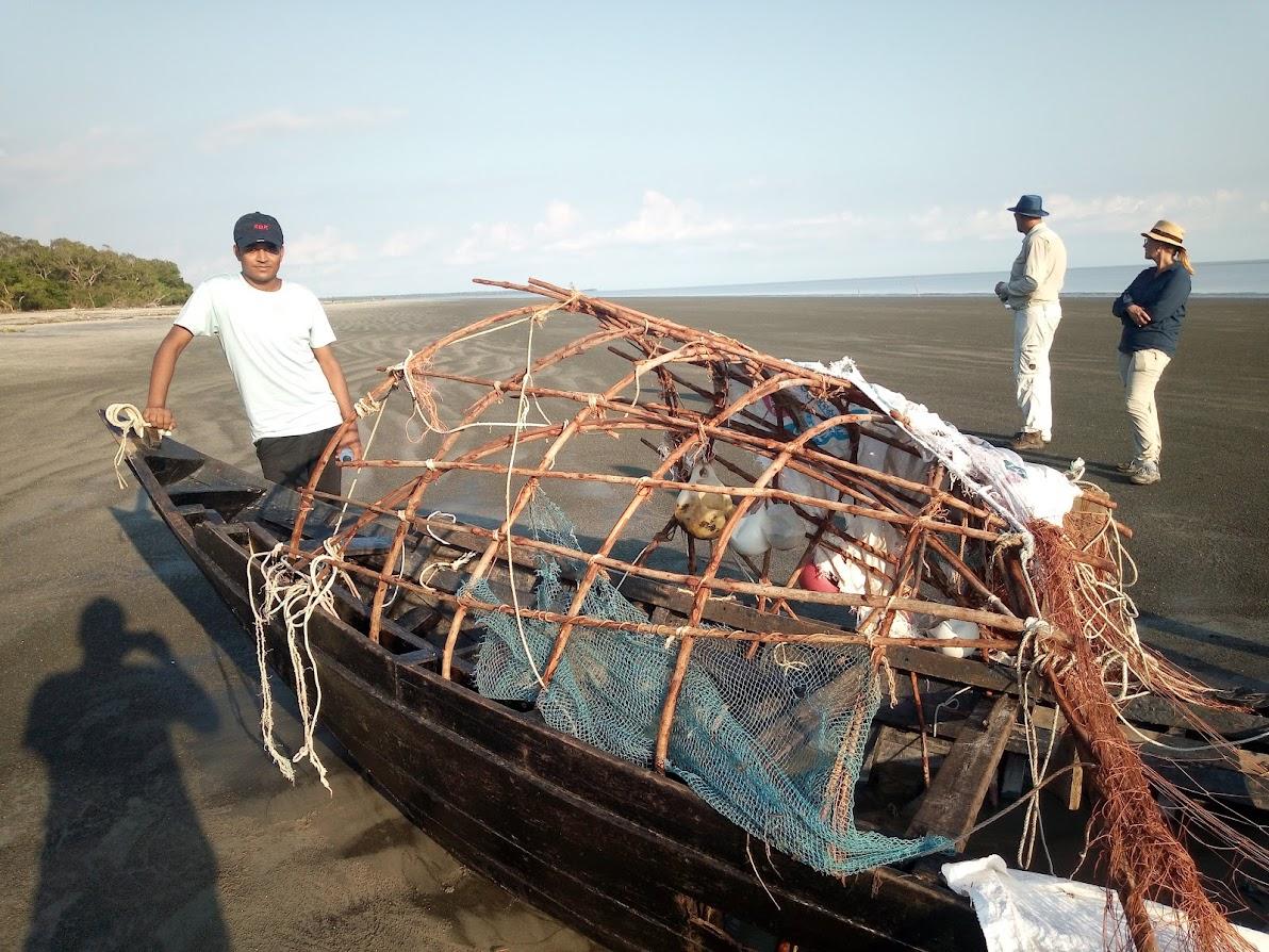 A broken fishing boat washed ashore after a storm. No sign of fisherman 