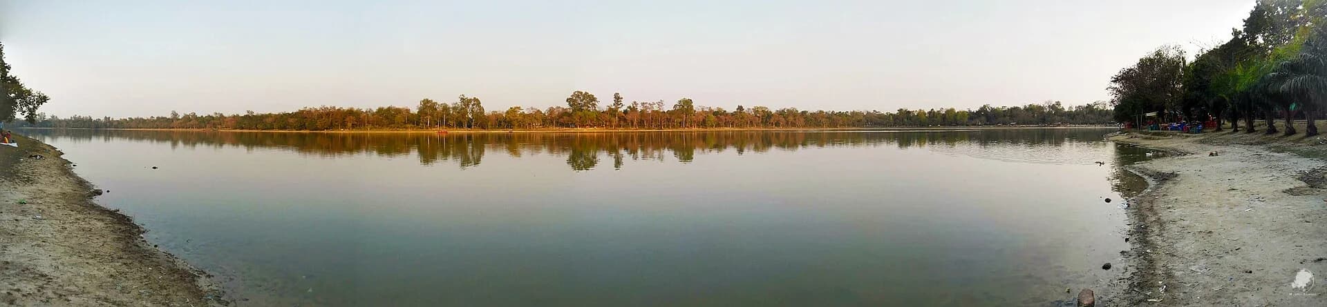 Water and wooded bank of Ramsagar lake in Dinajpur